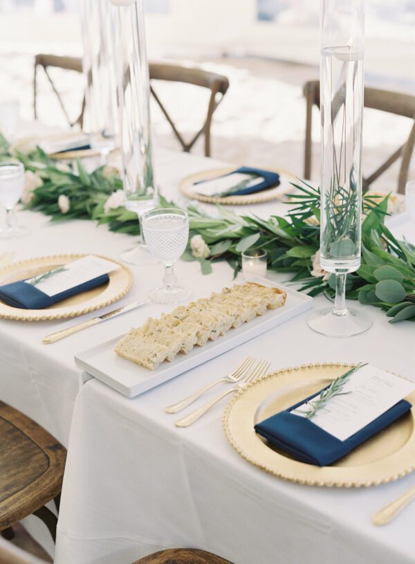 gold charges and gold flatware table setting