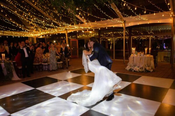 Black and white dance floor with cleartop tent and lighting