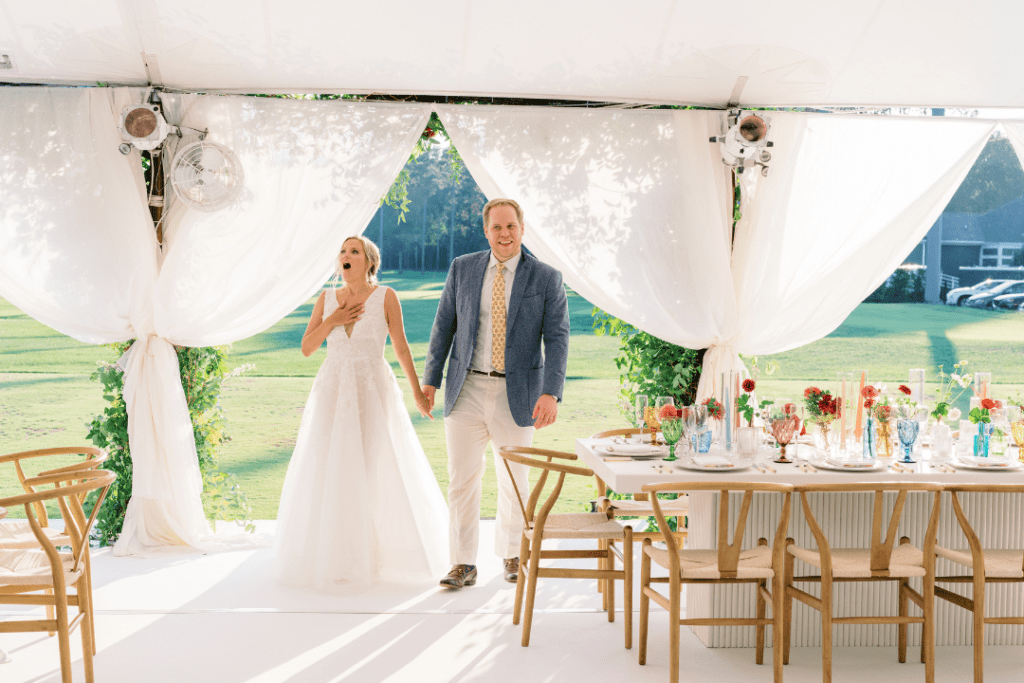 Couple entering sailcloth tent for the first time during their wedding