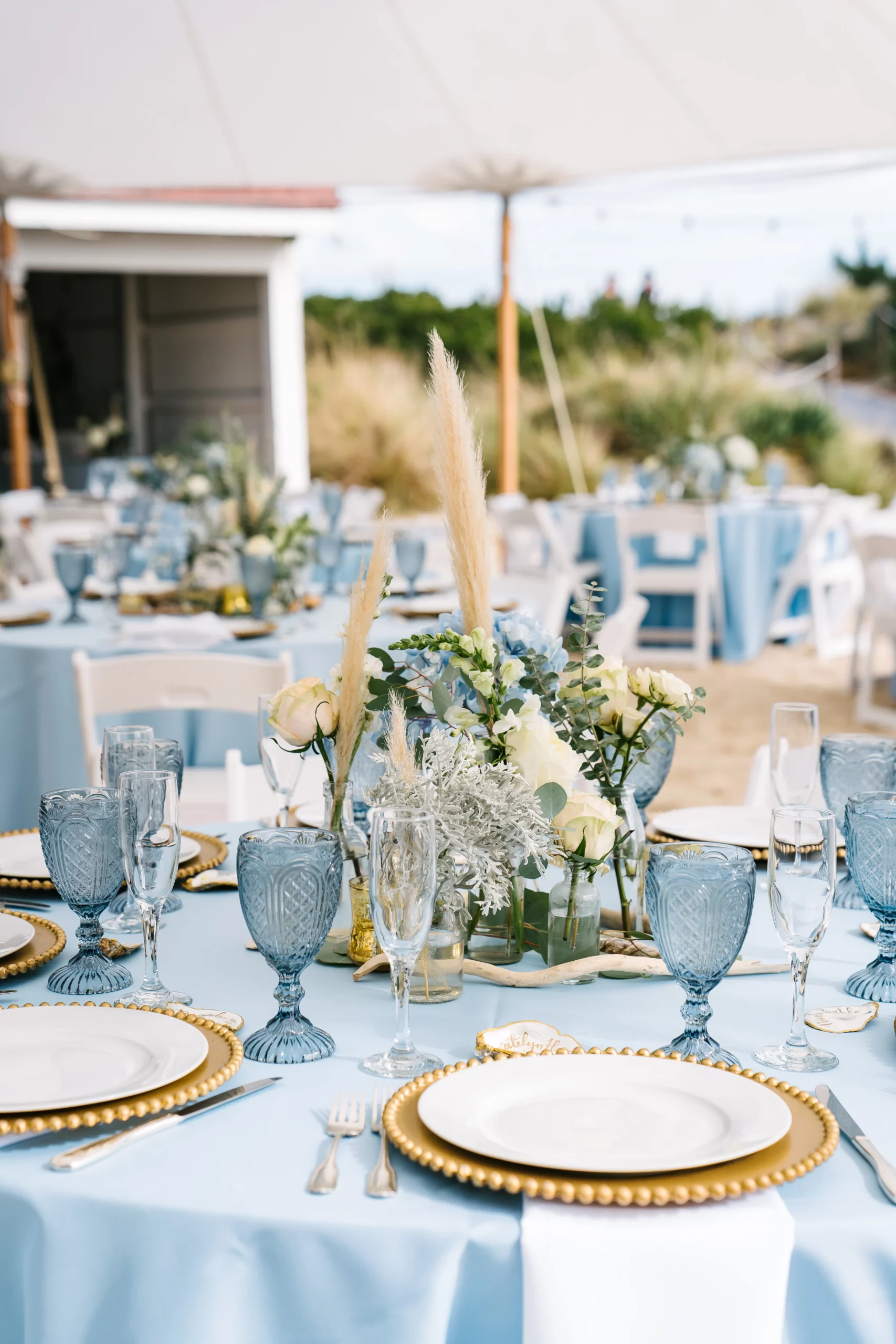 beach wedding, blue goblets gold chargers