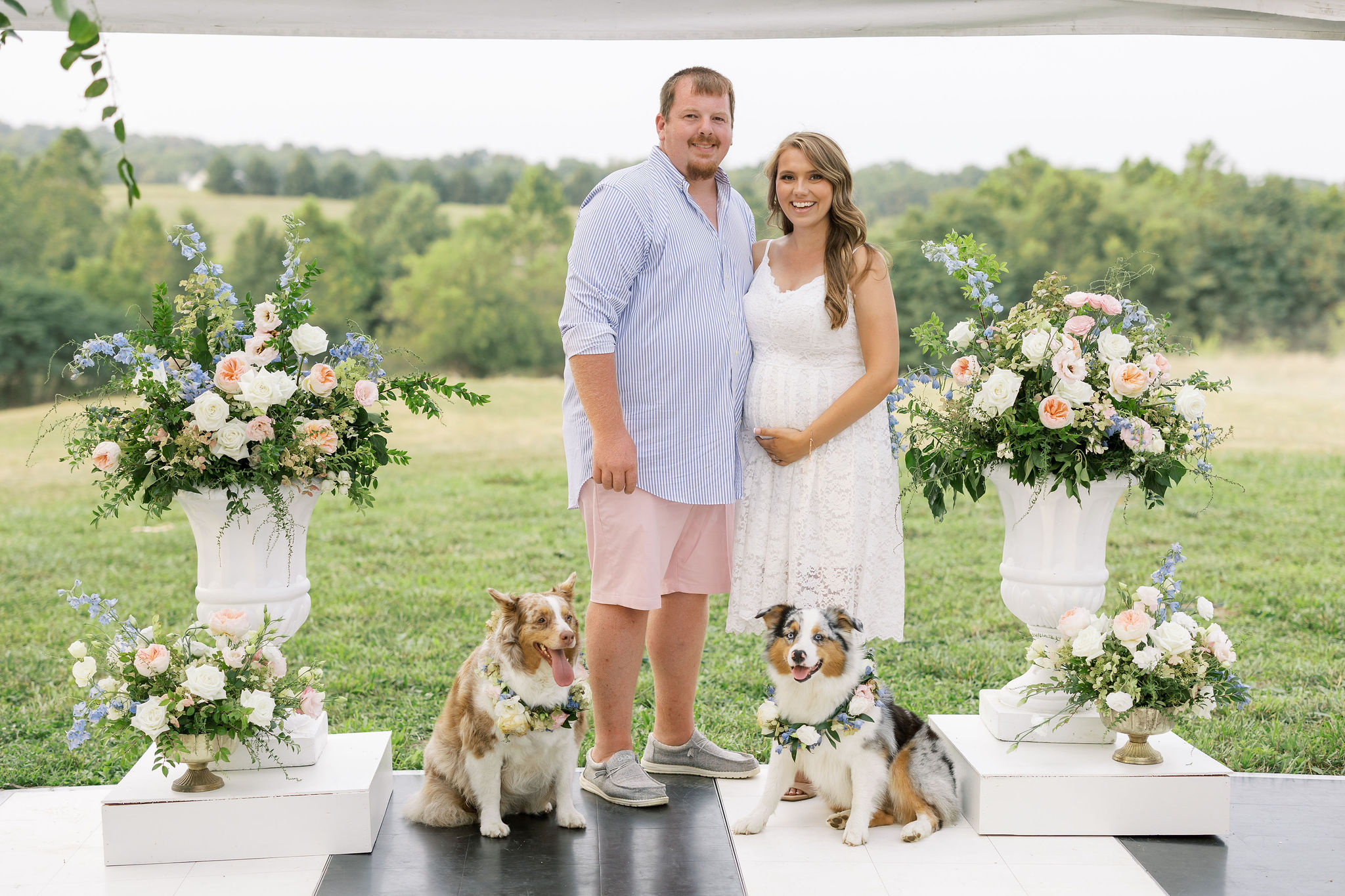 happy couple with dogs at baby shower