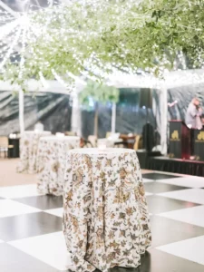 Fun Floral Print Cocktail Tables on top of a black and white dance floor
