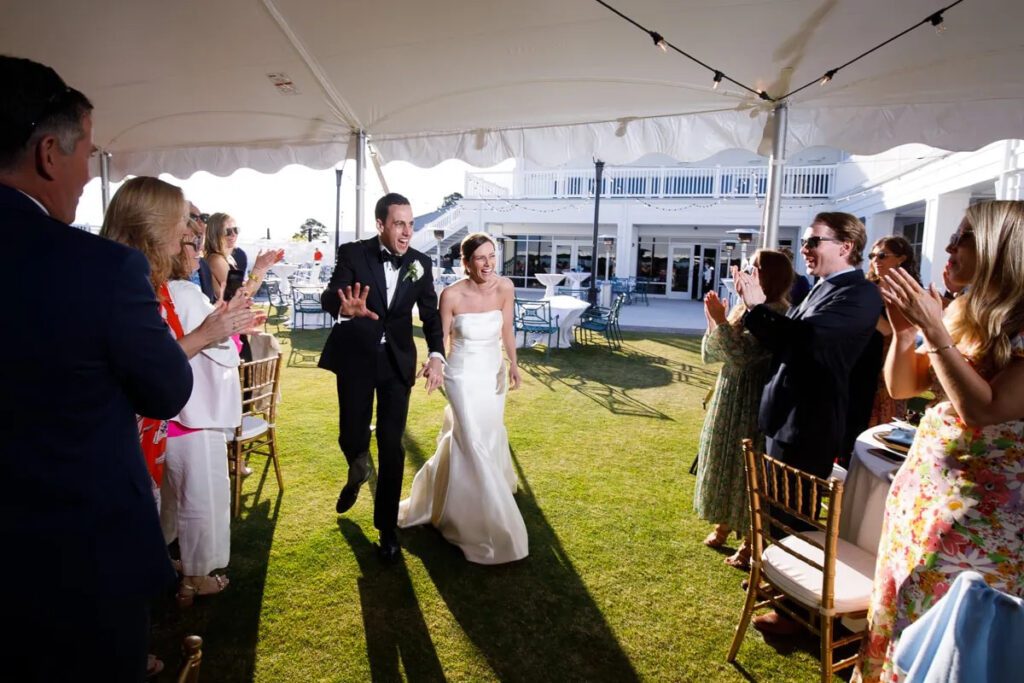 bride and groom entering reception tent in rehoboth beach delaware