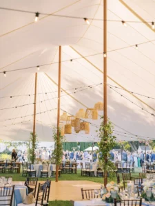 Interior of a sailcloth tent for a wedding in New Jersey with lanterns in the center of the tent