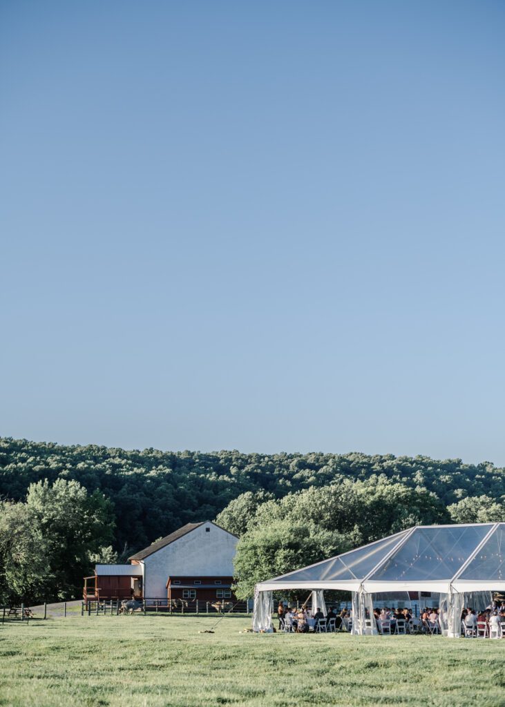 clear top wedding tent set up on lawn