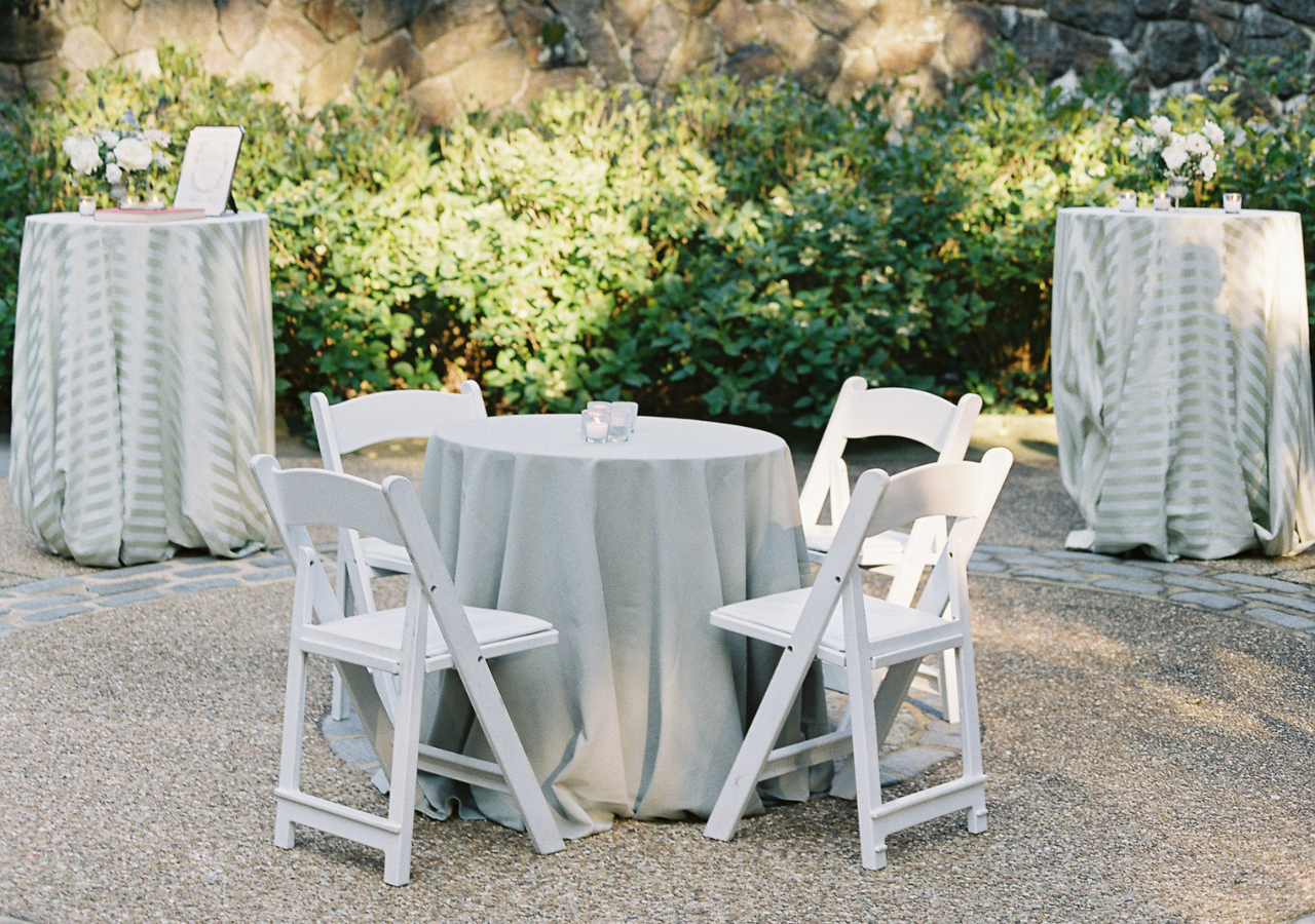 Bistro tables and cocktail tables with linens