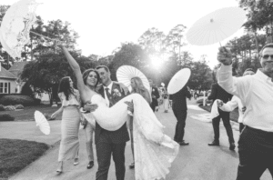 Groom carrying bride during recessional