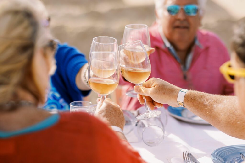 group of friends celebrating with wine