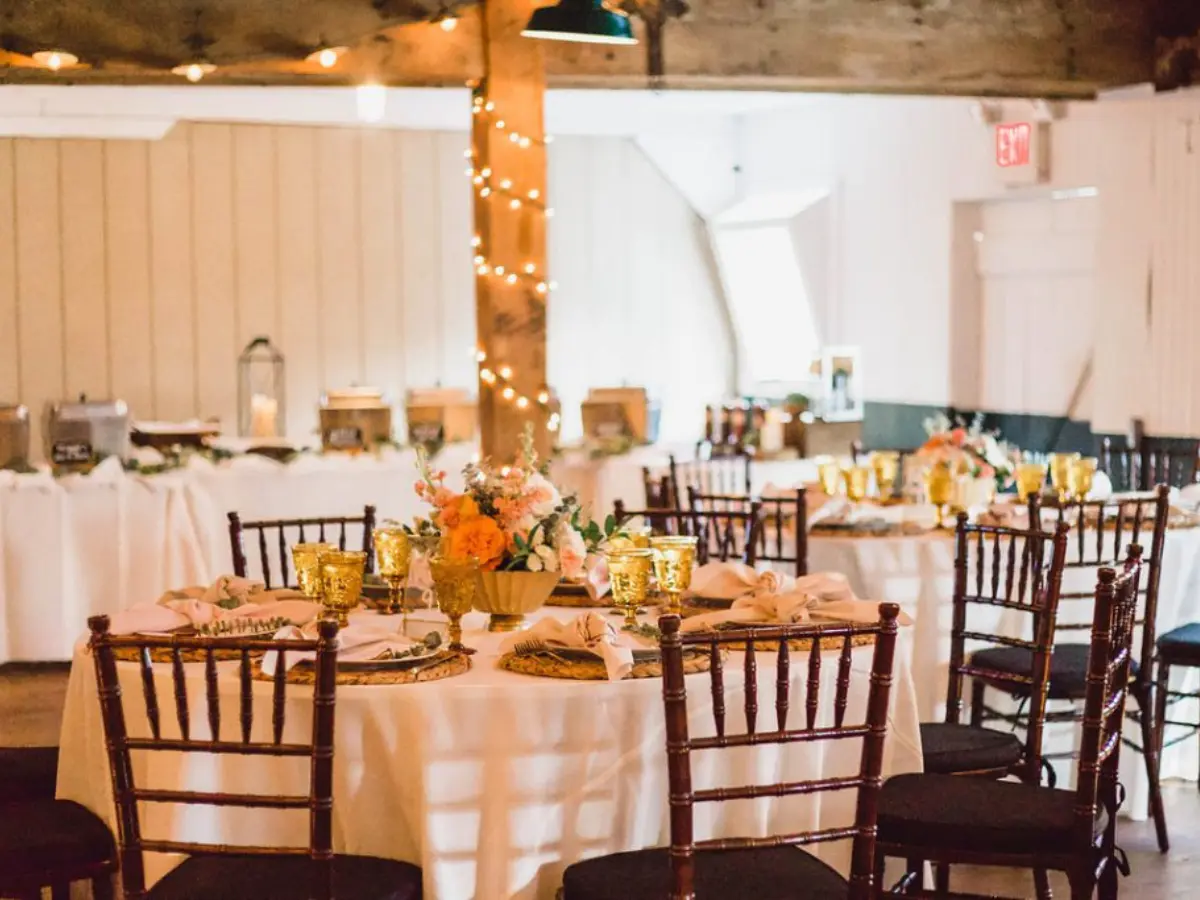 mahogany chiavari chairs at a round table for a reception