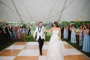 bride and groom, dancing on white and wooden checkered dance floor