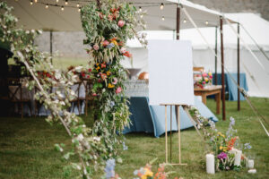 tent entrance with floral decor framing the entrance