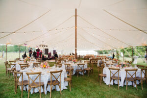 wedding reception set up under sailcloth style tent in Malvern PA