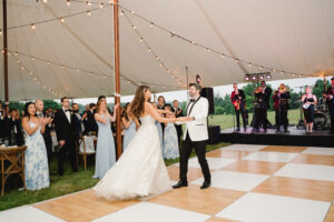 bride and groom dancing on birch and white dance floor at their wedding reception in Malvern PA