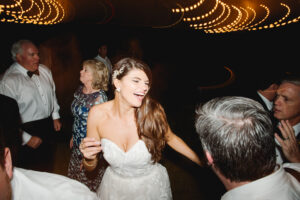 happy smiling bride, dancing during her wedding reception