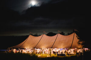 sailcloth tent, with light glowing through translucent tent top.