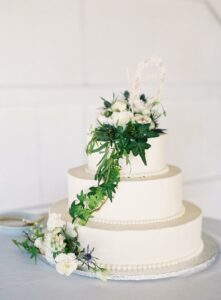 wedding cake white with greenery